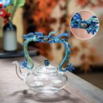 Glass teapot with two dragons chasing a pearl handle